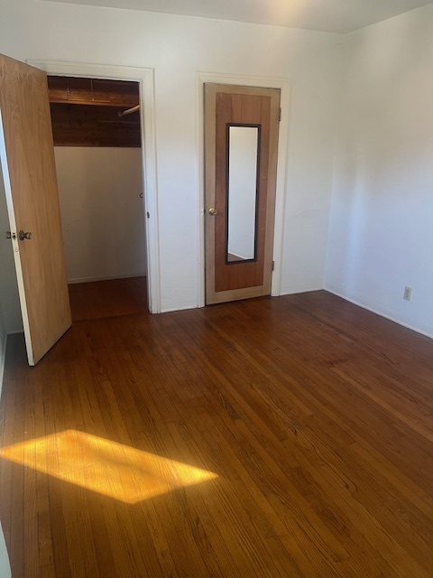 bedroom, oak floor, walk in closet - 625 W Maple St