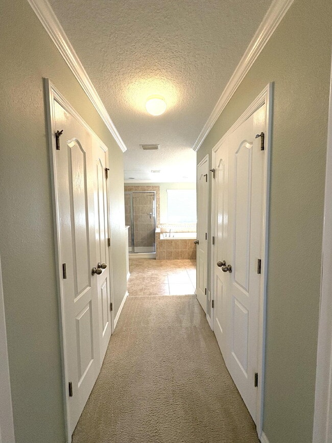 Building Photo - Spacious 5-Bedroom Pool Home with Putting ...