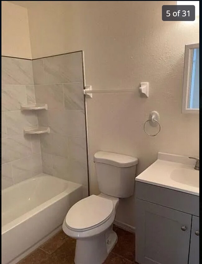 Building Photo - 2/2/1 home with a spacious fenced backyard...