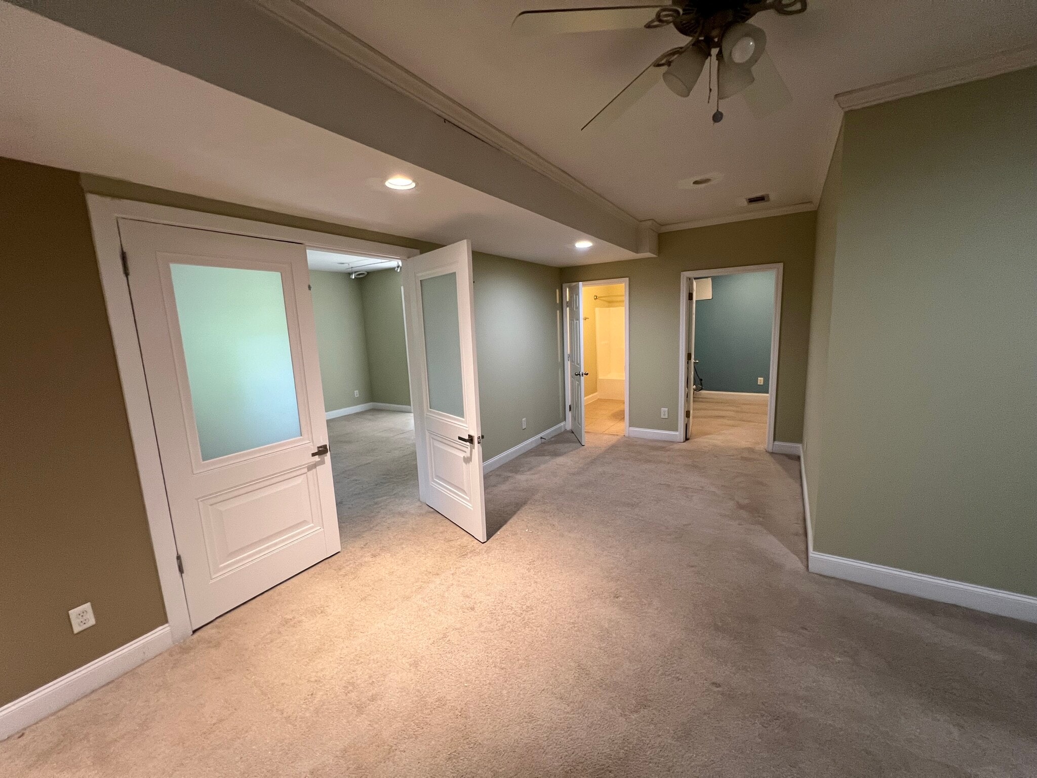 Primary bedroom with access to second room with washer/dryer hookups and closet space as well as bat - 3734 Looper Rdg