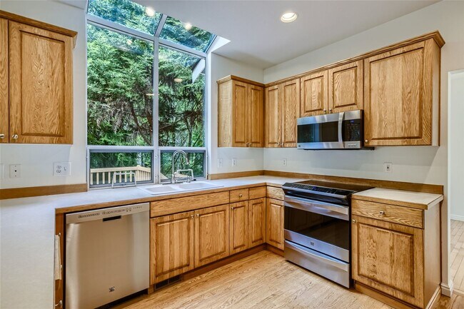 Building Photo - Spacious 4-Bedroom Home in Kenmore | Private Greenbelt Setting + Landscaping Included