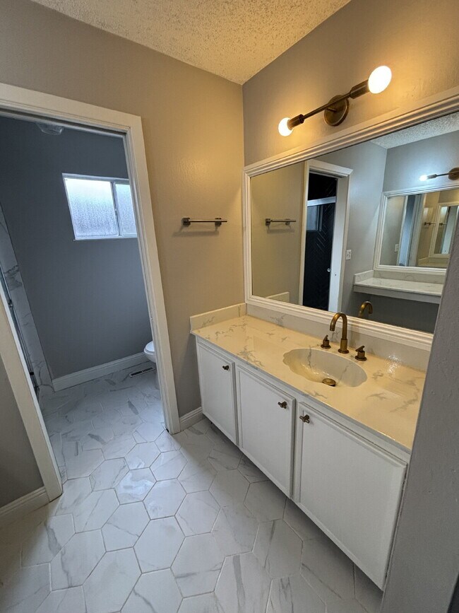 Building Photo - "Charming Concord Retreat: 3-Bedroom Gem with Granite Accents & Cozy Fireplace"