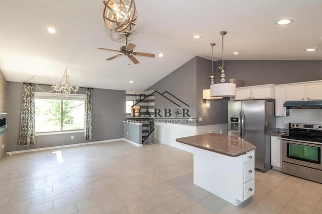 Building Photo - Updated 4 Bedroom Home with Remodeled Kitchen & Tiered Deck