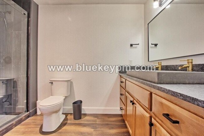 Building Photo - 3 Bed, 3.5 Baths Townhome With Garage Level Suite and Office Space