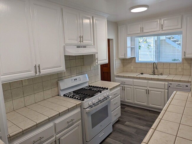 Many cabinets, new dishwasher and new steam-cleaning stove with griddle - 1830 S Curson Ave