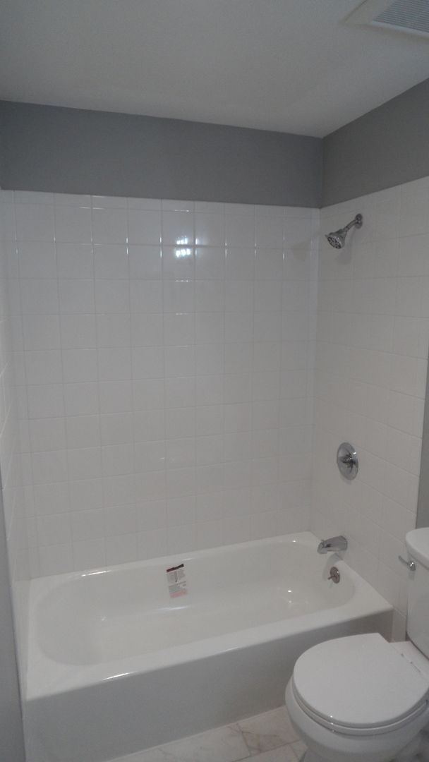 Building Photo - REMODELED 2BR; 1BA end unit condo w/ 1 car garage & 1 parking space