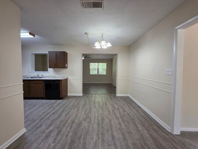 Building Photo - Nicely updated 3BR/1.5BA with fenced in ba...