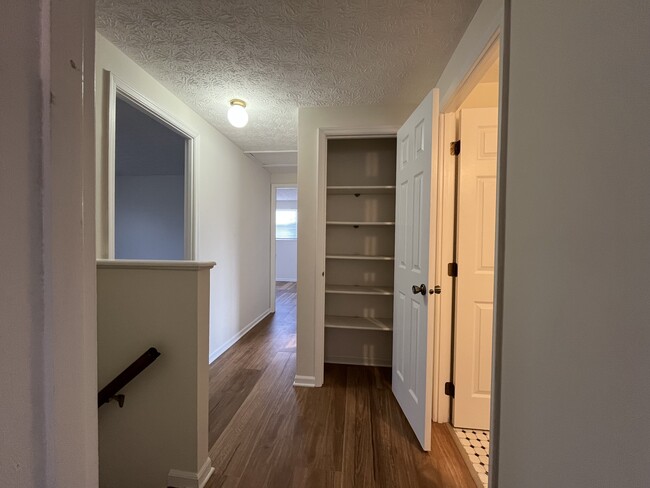 Upstairs Hall w/Linen Closet - 6491 Baffin Dr