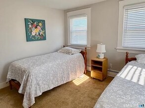Building Photo - Charming three-bedroom, 1.5 bath fully furnished