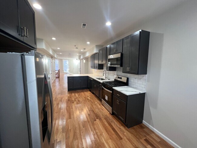 Building Photo - East District 3 BR/3.5 BA End Row Home w-Private Parking