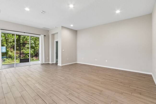 Building Photo - Modern 4BR Home with 3 Full Baths in River Glen | Screened Porch & Resort-Style Amenities