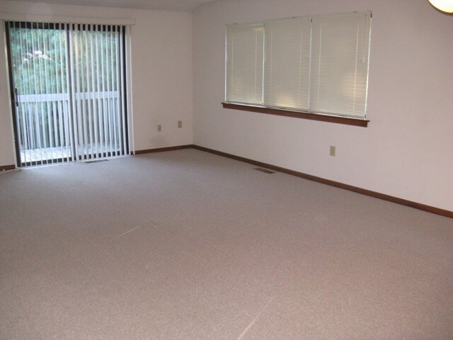 Large, open Living room with sliding doors to the balcony. - 107 Hilltop Dr
