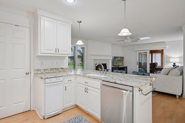 Open to the spacious sitting area off the kitchen - 145 Holly Ln N