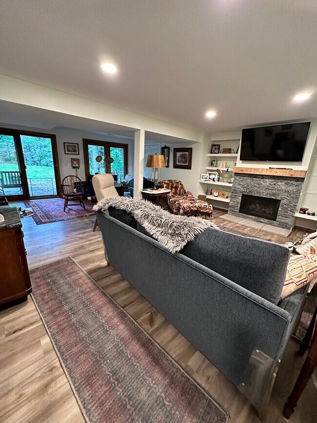 Building Photo - Dream Home in Highland, Michigan: Your Private Oasis on 5 Wooded Acres