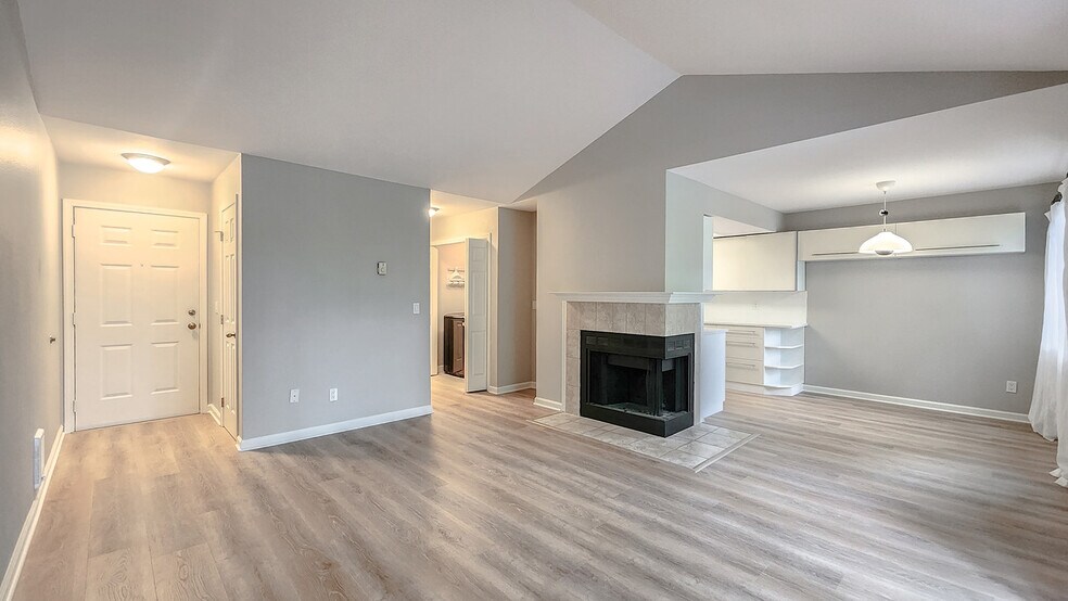 Entry way open to living room with fireplace - 9580 SW 146th Ter