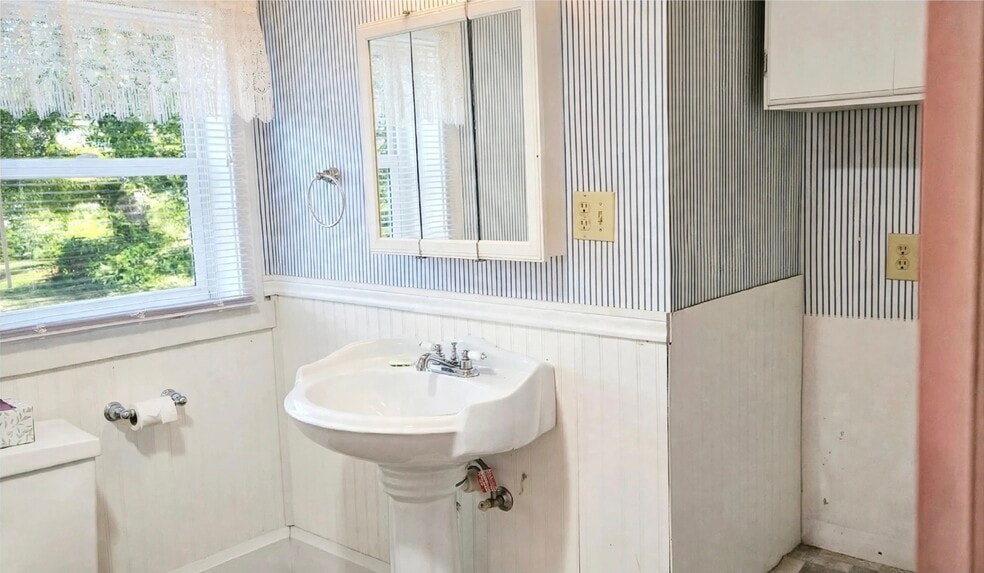 Washer/dryer hook-up to the right of the sink. Storage above w/d hook-up. Storage closet by the door - 76 N Main St