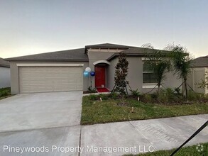 Building Photo - "Spacious 4-Bedroom Sanctuary with 2 Baths...