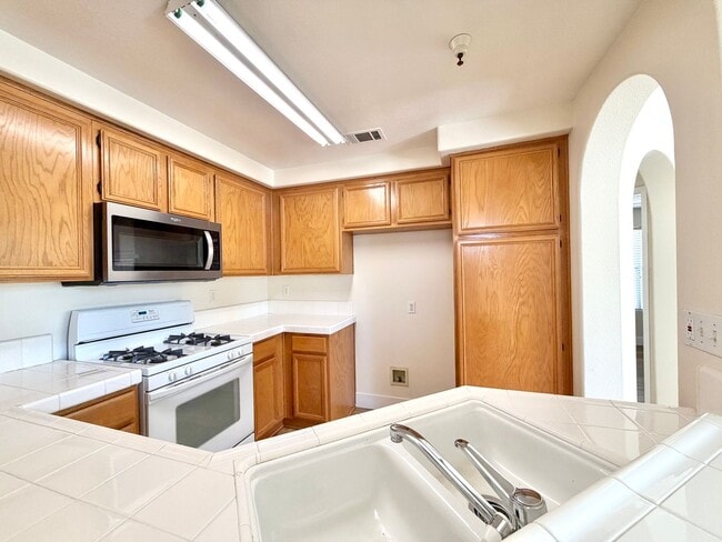 Building Photo - Stylish 2-Bedroom Condo in Gated Community with Balcony & Amenities