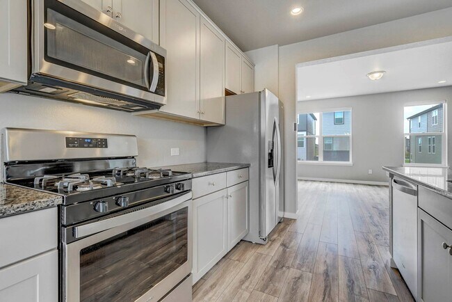 Building Photo - Modern 4BR with Open Kitchen, Patio & 2-Car Garage