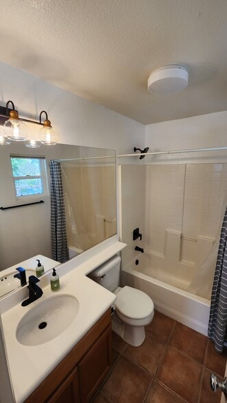 Guest bathroom with new lighting and hardware - 16939 Robins Nest Way