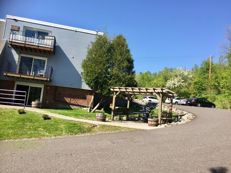 Side build with common grill area & Parking lot - 1331 W 3rd St