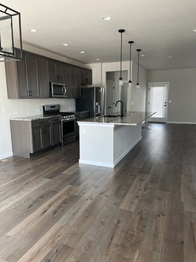 Building Photo - MODERN THREE STORY TOWNHOME WITH 2 CAR GAR...