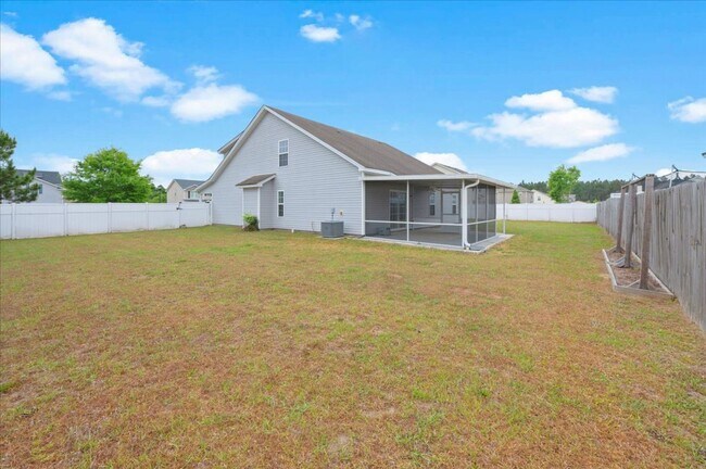 Building Photo - Spacious 5-Bedroom Home with Screened Patio & Private Fenced Yard in Guyton