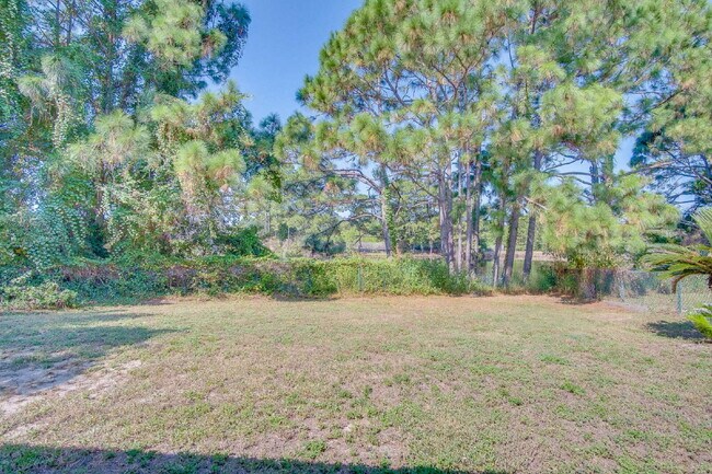 Building Photo - Lakefront Living in Gulf Breeze – Spacious...