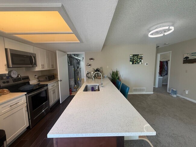 Building Photo - Spacious, Sunlit 3BR / 2 BA Condo just steps away from Standley Lake!