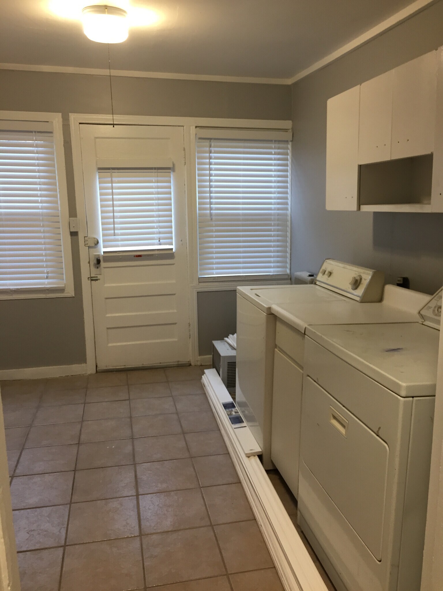Laundry room leads to back door and access to second bedroom - 2812 NW 15th St