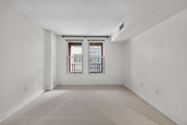Building Photo - Penn Quarter 1BR Condo with Balcony, Garage Parking, Storage, Concierge, and Rooftop Deck.