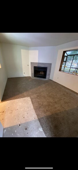 Living room also has a fireplace and breakfast bar counter that connects to kitchen. - 20005 1st Ave S