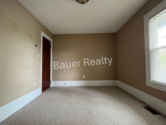 Building Photo - Three bedrooms, one and a half baths