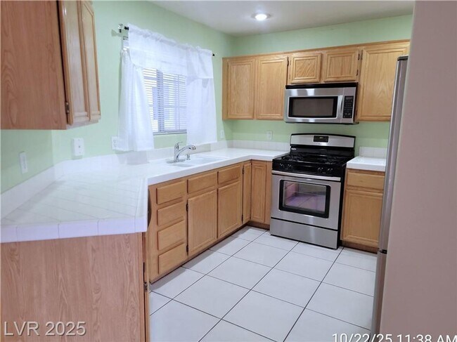 Building Photo - Inviting Green Valley Condo with Dual Balc...