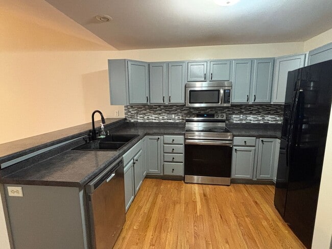 Building Photo - Spacious 3BR/3BA Condo with Finished Basement + 2-Car Garage — Available Now
