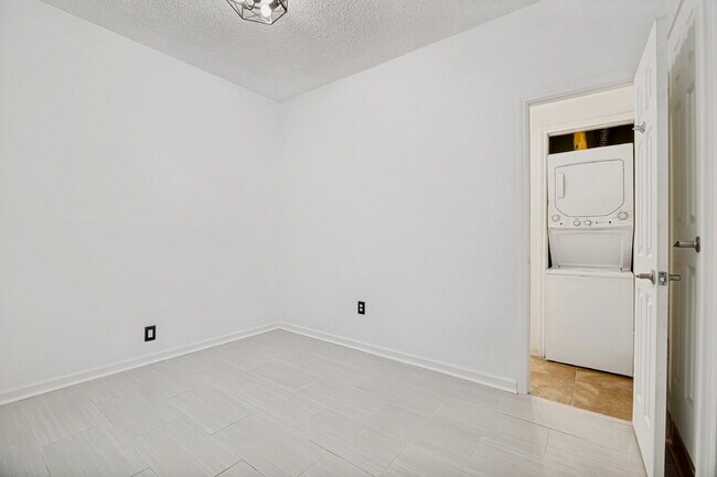 Building Photo - Spacious Dallas Condo with Unbeatable Storage, Private Patio & Carport