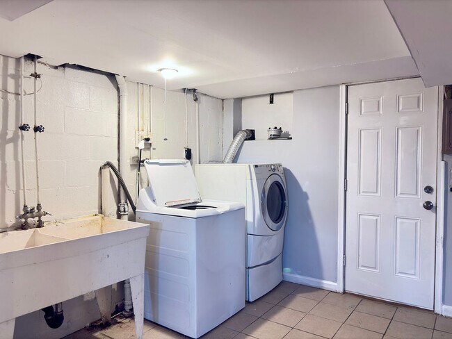 Building Photo - Charming Brick Home with Finished Basement, Modern Kitchen & Spacious Yard