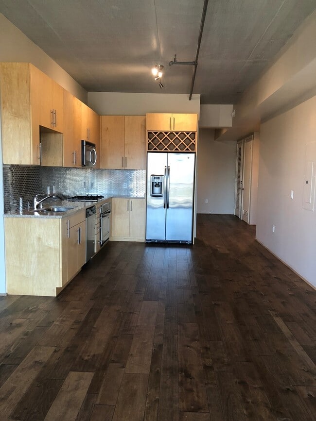 Building Photo - JUHL LOFT STYLE LIVING 1 BEDROOM + DEN UNIT FOR LEASE !!!