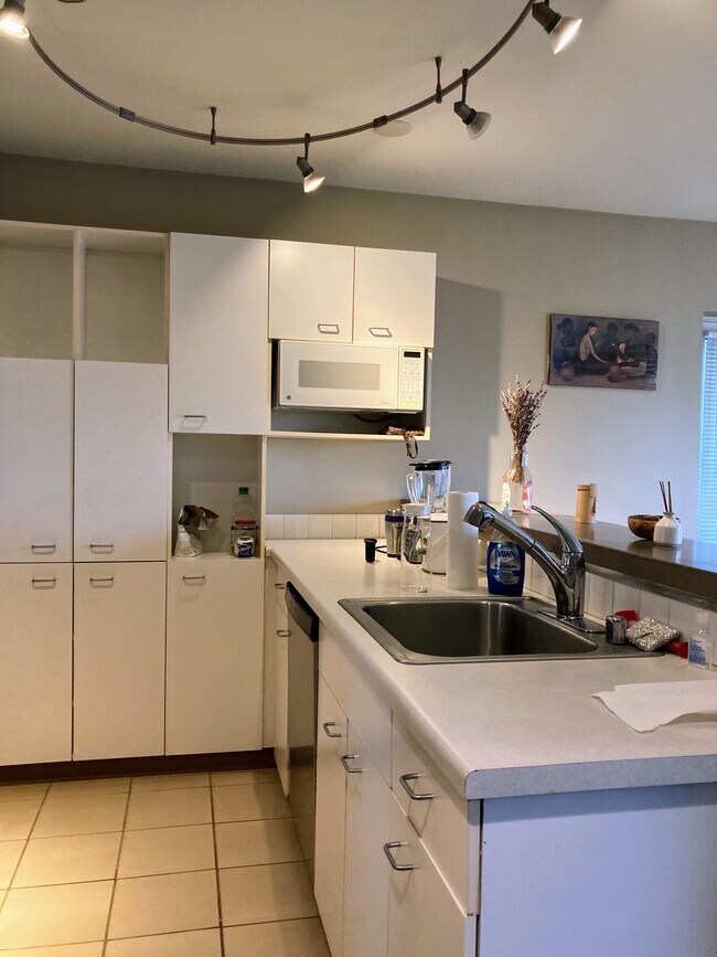 Kitchen with stainless steel appliances - 2440 Western Ave