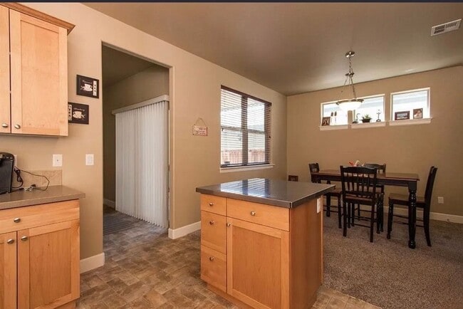 Building Photo - Spacious 4-Bedroom Home with New Paint & Carpet, Fenced Yard