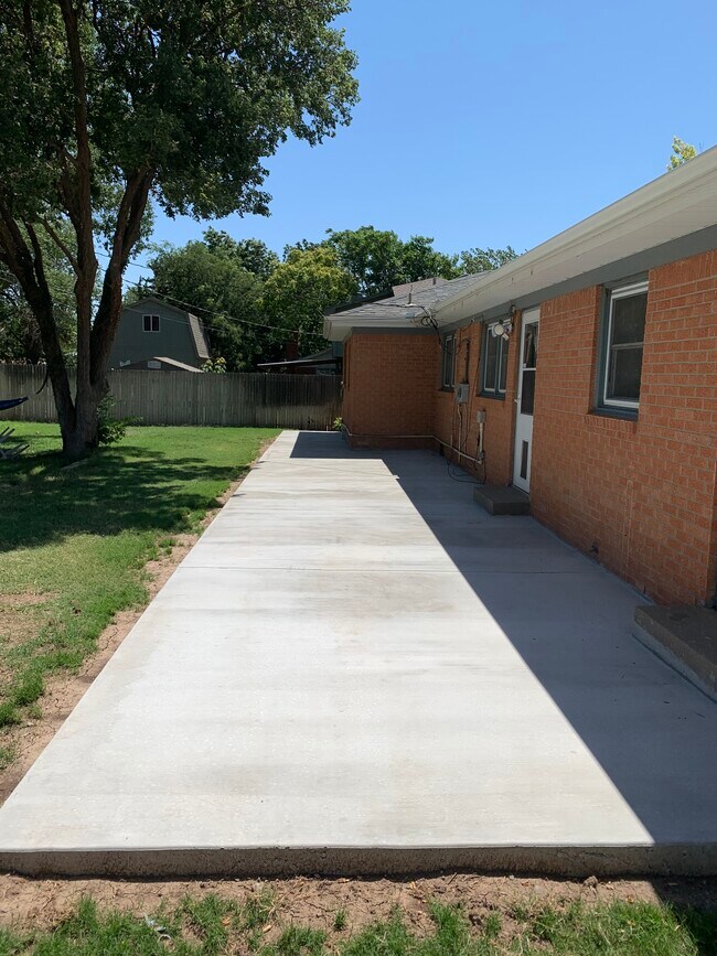 Brand new slab poured the entire length of the back of the house. - 4308 Olsen Blvd