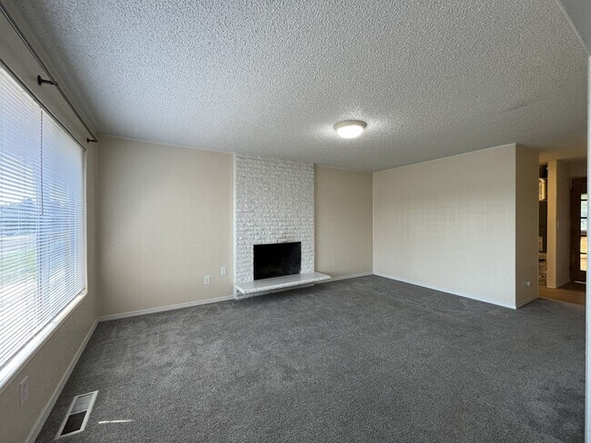 Building Photo - Charming Ranch Home with Sunroom or 4th Bedroom, Two-Car Garage and Fenced Backyard