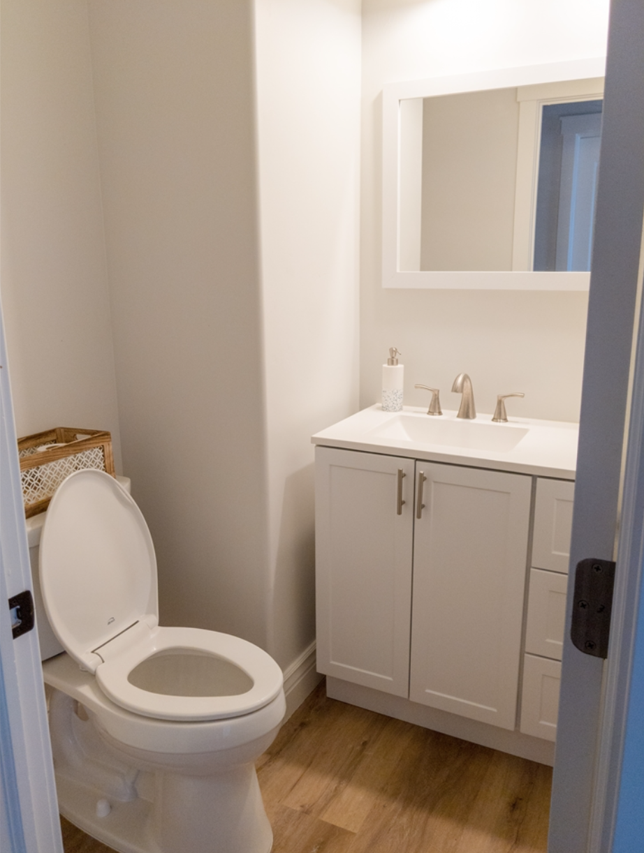 Half bath next to upstairs laundry room; Laundry room/mud room not pictured. - 14487 S Cuchara Way