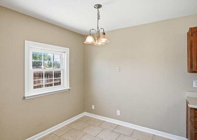 Building Photo - Corner-Lot Garden Home with a Private Patio.