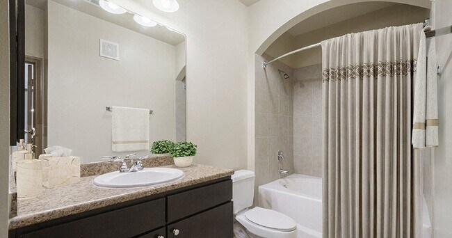 Building Photo - Spacious Living with Urban Convenience!