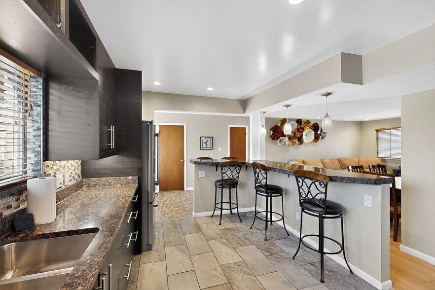 spacious kitchen with bar seating - 4715 Marquette Ave NE