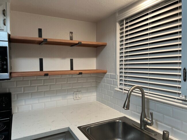 Kitchen window looks put on backyard - 1830 Polk Way