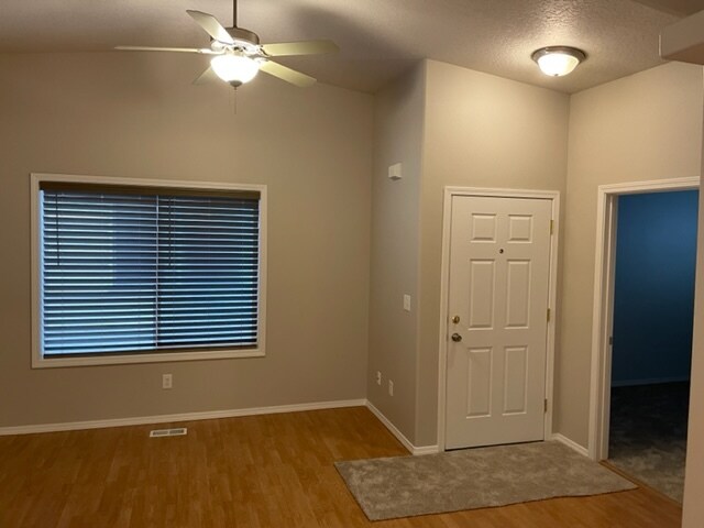 Front door entry area with ceiling fan. - 3065 S Ladera Pl