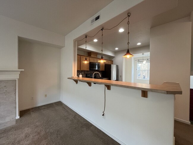 Building Photo - Beautiful 2 Bedroom Townhome with Walk-In Closets Private Deck & Attached Garage