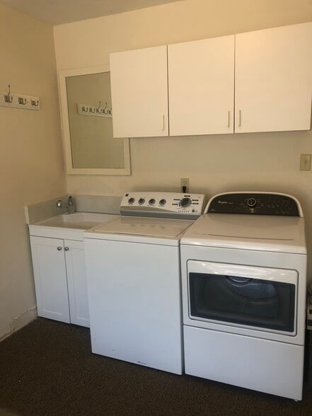 Washer and dryer in garage with sink - 912 Roosevelt St